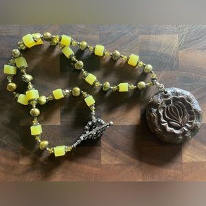 Hand carved stone lotus pendant on sterling with pearl and Swarovski crystals.